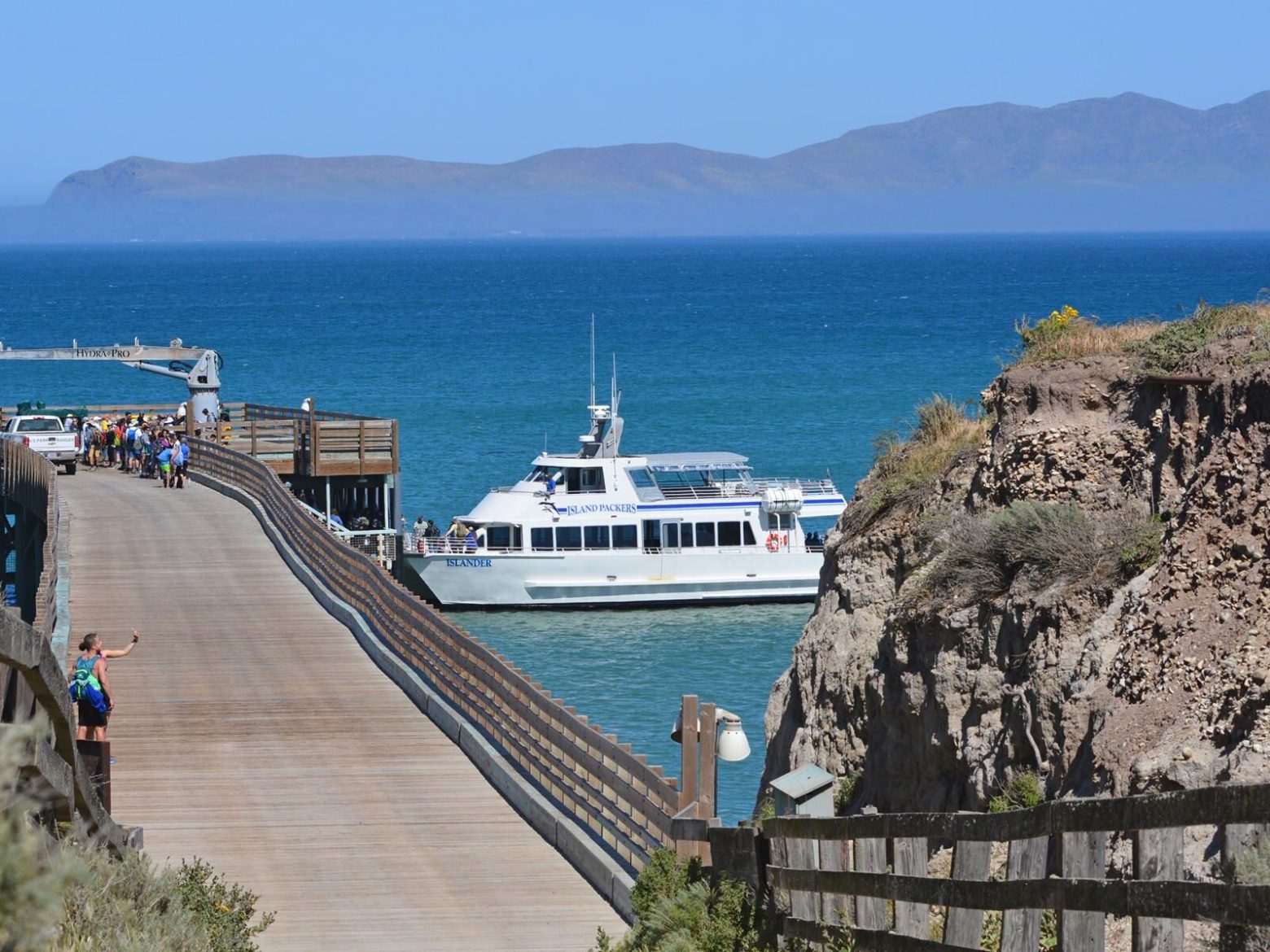 a boat is docked next to a body of water