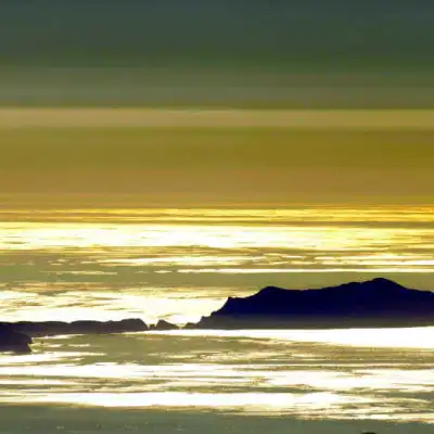 a sunset over a body of water