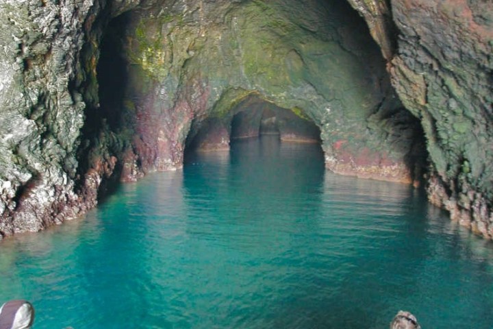 a cave that is swimming in the water