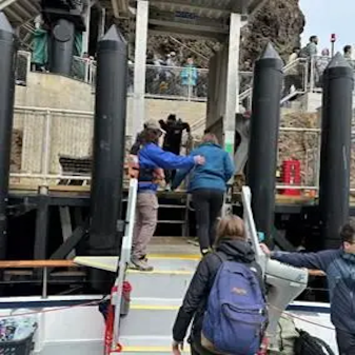 a group of people walking down a street