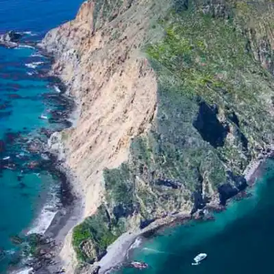 a view of water and a mountain in the background