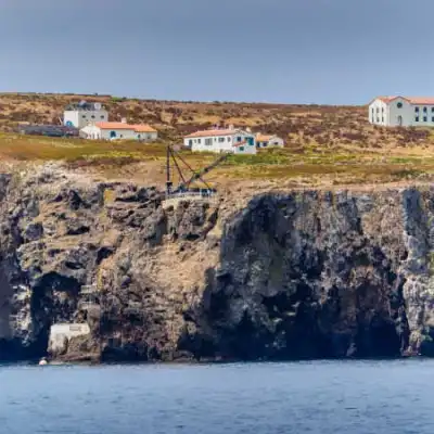 a body of water with a mountain in the background