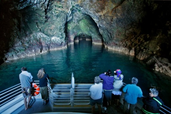 a group of people standing in front of a body of water