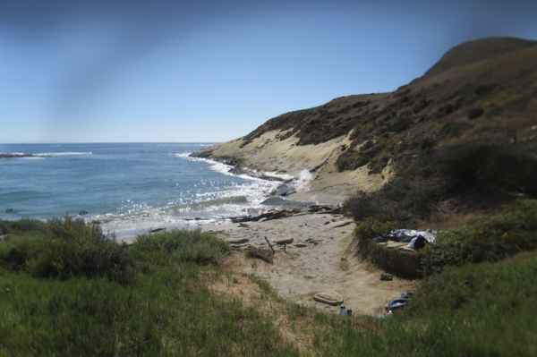 a body of water with a mountain in the background