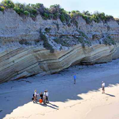 a group of people riding skis on a snowy mountain