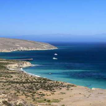 a view of a beach next to the ocean