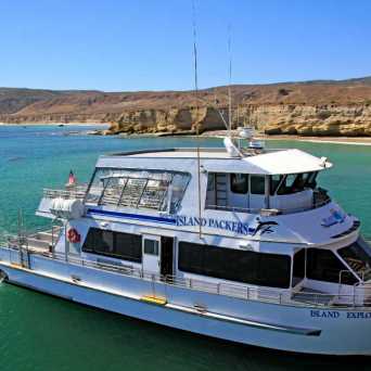 a boat is docked next to a body of water
