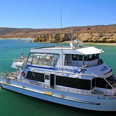 a boat is docked next to a body of water