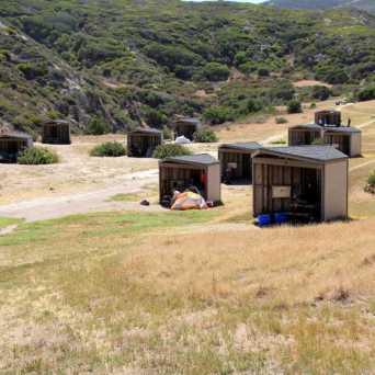a train is parked on the side of a mountain