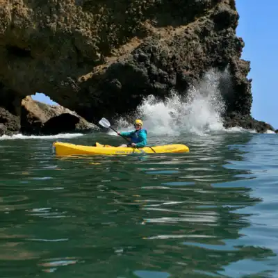 a person riding a wave on a surfboard in the water