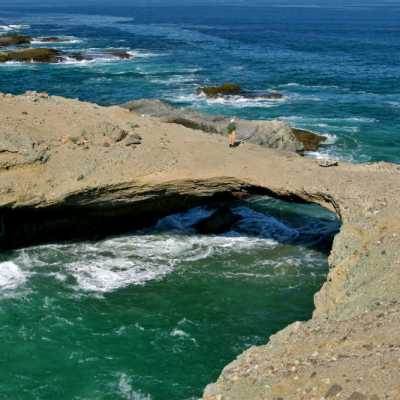 a rocky beach next to the ocean