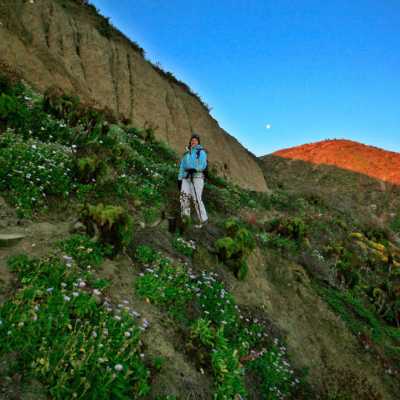 a man standing on a rocky hill