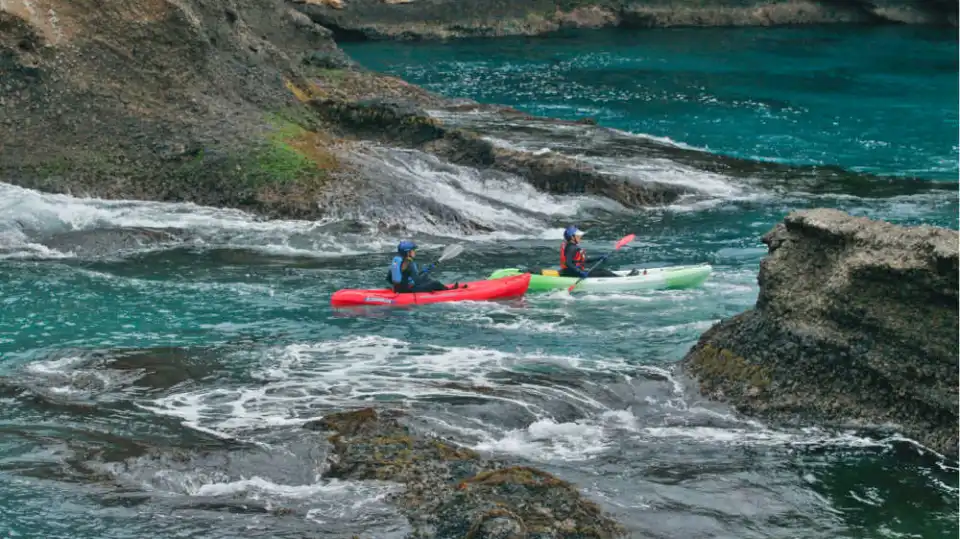 a person riding a surf board on a body of water
