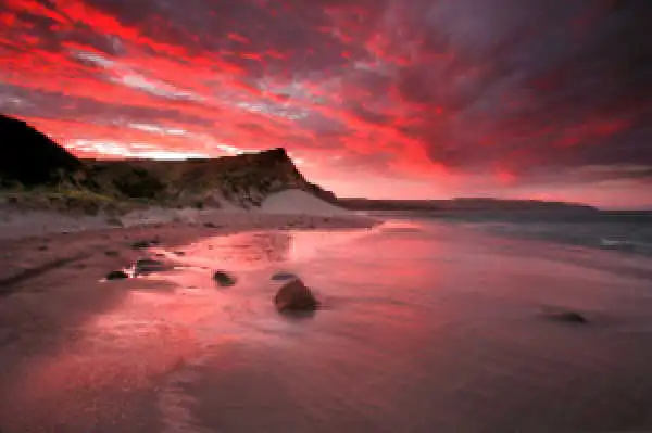 a sunset over a body of water