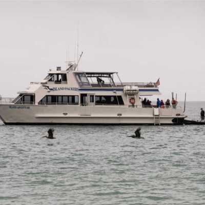 a group of people on a boat in a large body of water