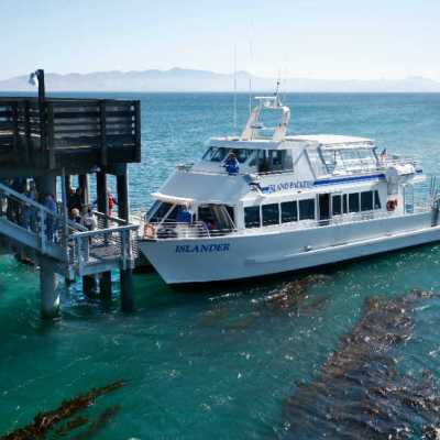 a boat is docked next to a body of water