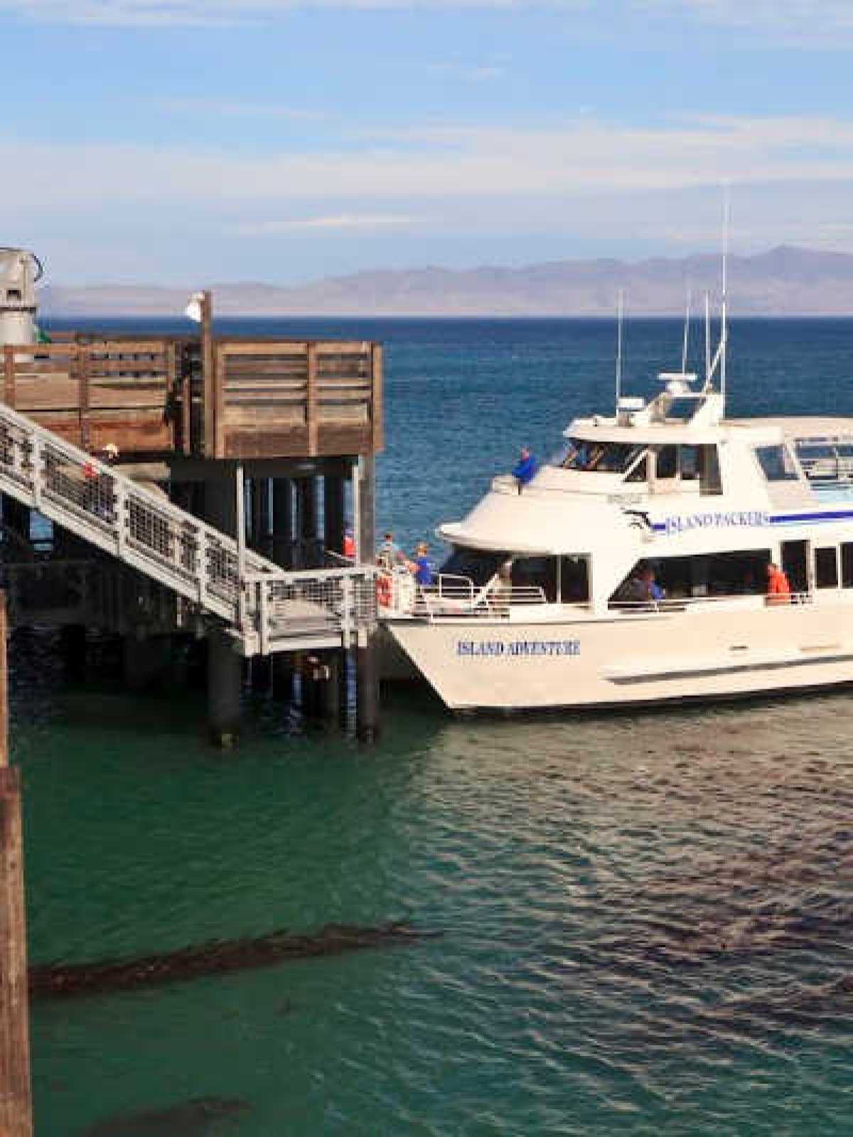 a boat is docked next to a body of water