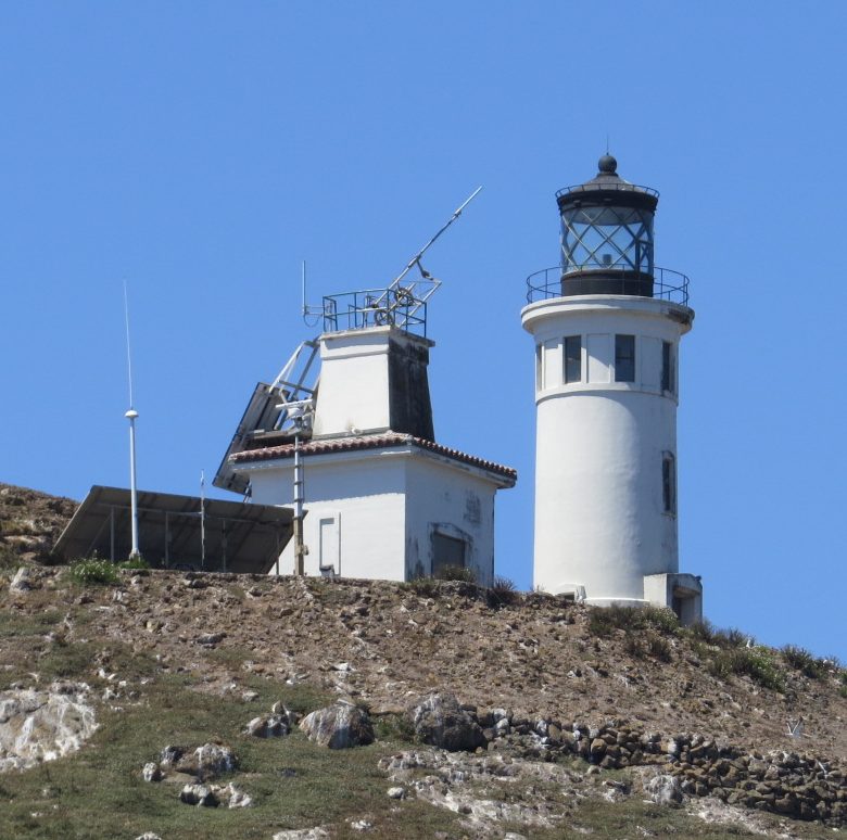 a tower that has a rocky hill