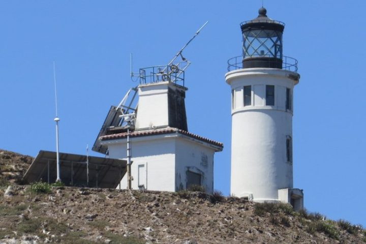 a tower that has a rocky hill